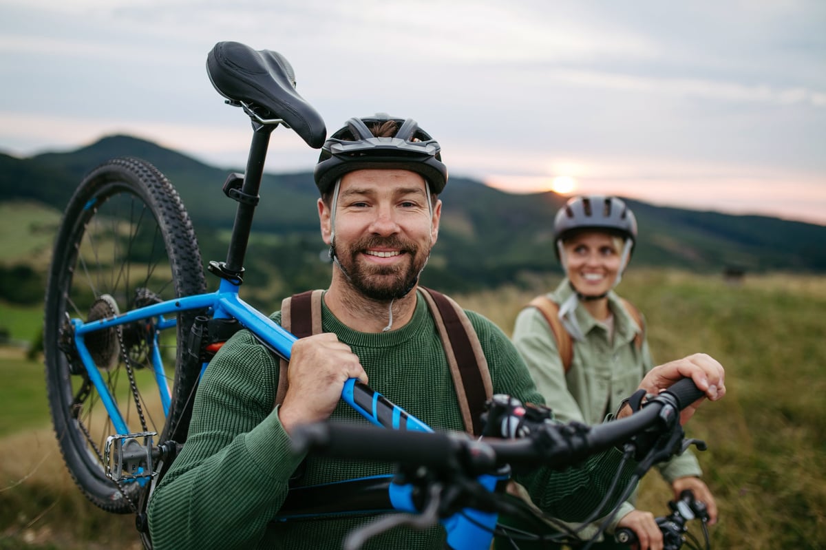 Couple cycling together in nature