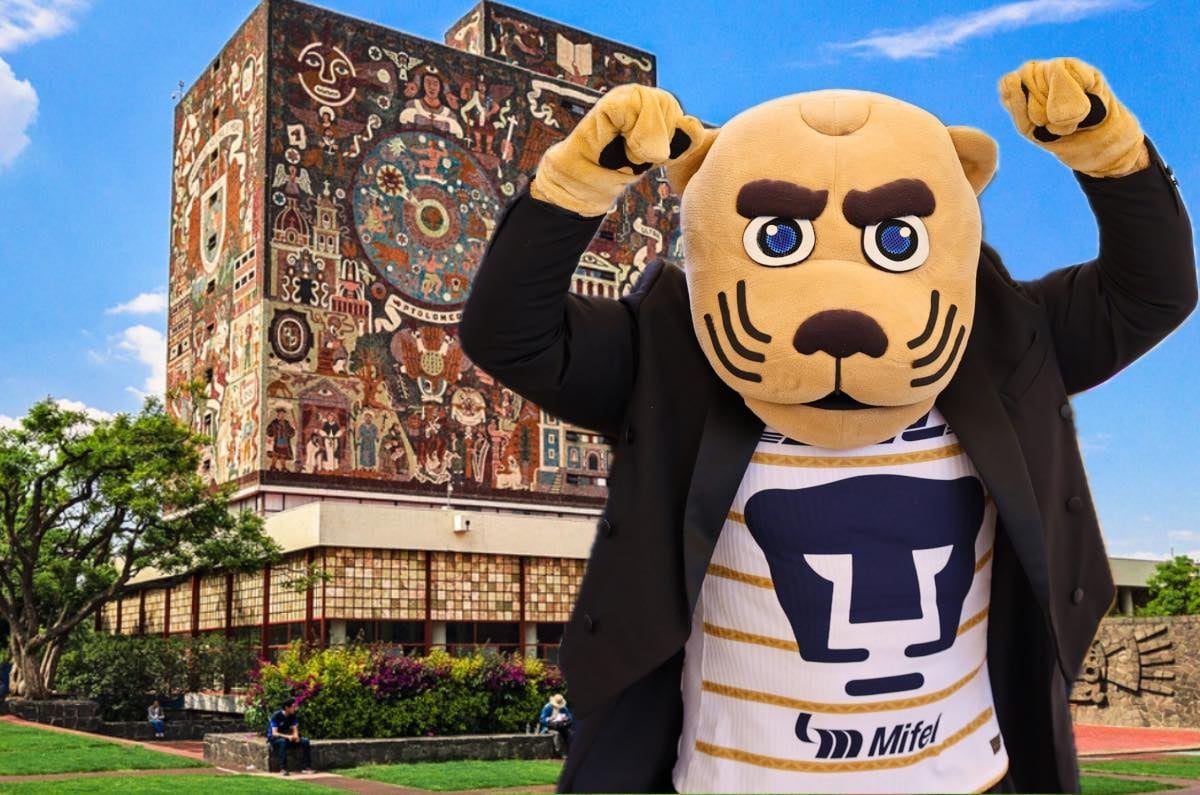Puma mascot with raised fists in front of ornate library building under blue sky